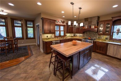Custom cherry cabinetry, 6 burner gas stove with c