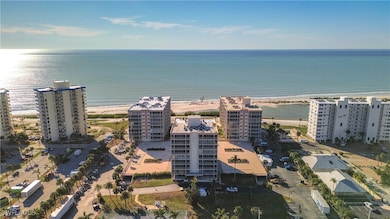 Drone / aerial view featuring a beach view and a w