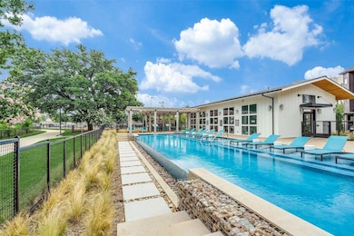 Community pool with a patio