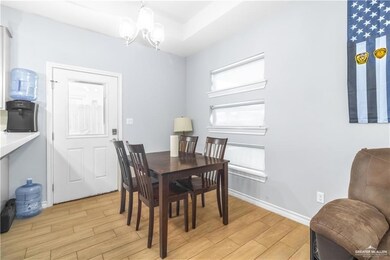 Dining room featuring a chandelier and light wood finished floors