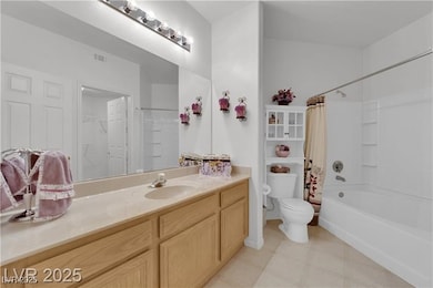 Bathroom with toilet, vanity, and shower / bath co