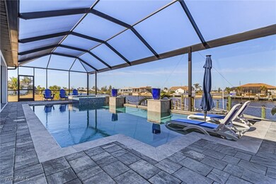 View of pool with a water view, an in ground hot t