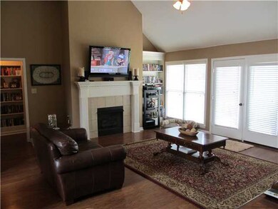 Gas log fireplace, built-in bookcases and lovely h
