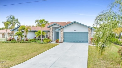 Single story home featuring stucco siding, a front yard, driveway, stone siding, and an attached garage