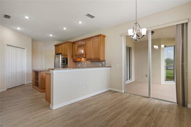 Dining room with a slider to the covered screened 