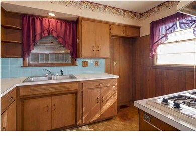 Kitchen view with stainless steal sink.