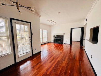 living room with hardwood / wood-style floors, cro