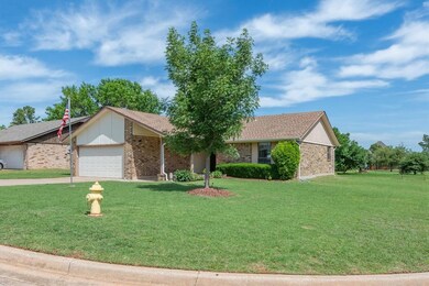 Ranch-style house with a front lawn and a garage