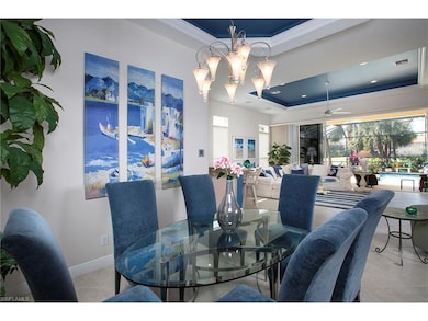 Dining room with lighted trey ceiling and crown mo