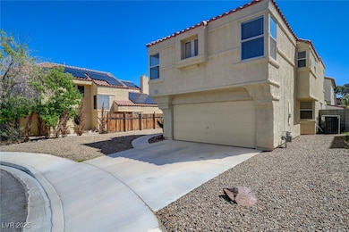 View of side of home featuring a tile roof, centra