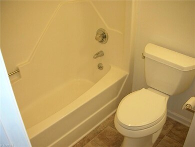 Primary Bathroom: Features include vinyl flooring for easy cleaning and fresh paint.