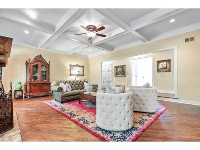 Crown molding and coffered ceiling perfectly compl