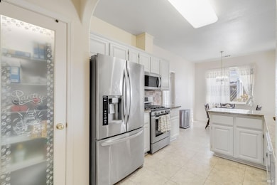 Spacious kitchen with ample storage and pantry