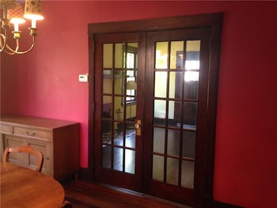 Beautiful French Doors divide the dining room and 