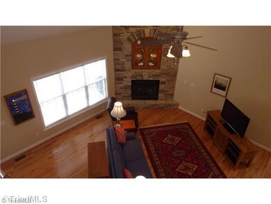 Living Room. WOW, wonderful open and spacious Living Room has rock fireplace, hardwood floors, easy access to deck.