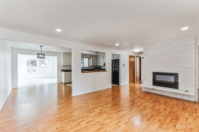 Upper Level Highlights: Enjoy an open living space featuring a new electric fireplace and fresh paint throughout.