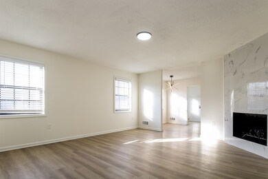 Unfurnished living room with plenty of natural lig
