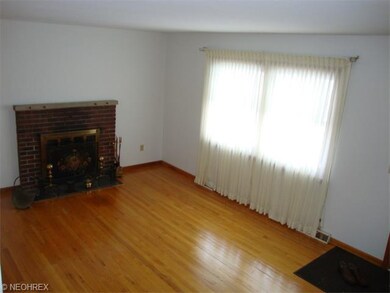 Large living room with fireplace and hardwood floo