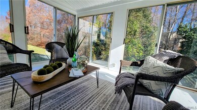  Five sliding glass doors open to create a screene
