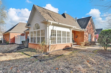 View of side of property featuring central AC