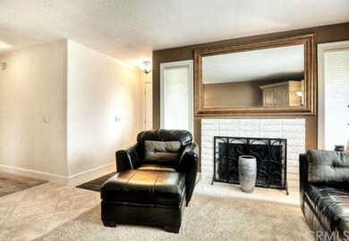 Open living room with fireplace.