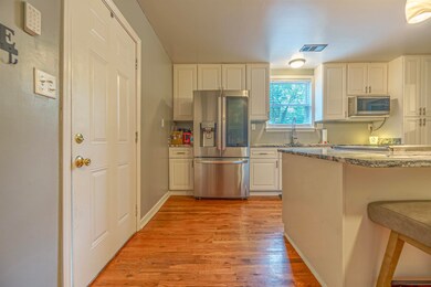 Kitchen with appliances with stainless steel finis