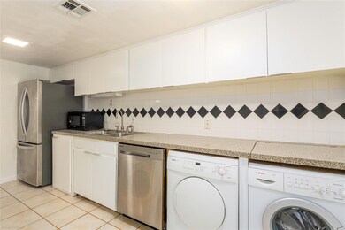 Kitchen featuring appliances with stainless steel