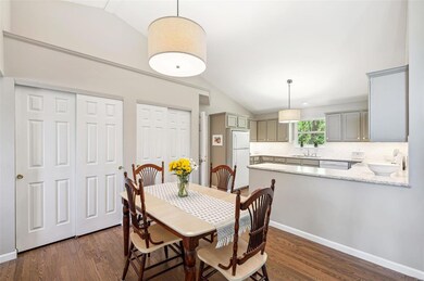 Eat-in kitchen, hardwood floors throughout the din
