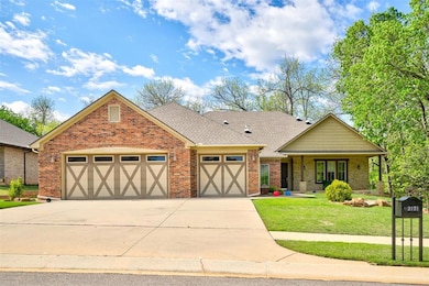 View of front facade featuring a front lawn, drive