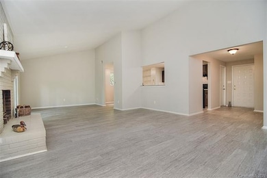 Open to the dining room and offers a pass through window to the kitchen making it more of an open floor plan.