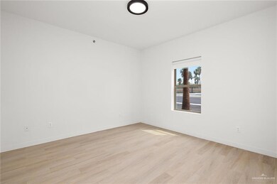 Spare room with light wood-type flooring