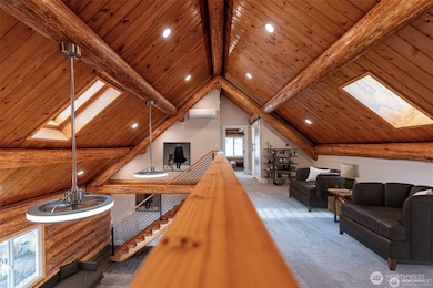 Loft with vaulted ceilings, skylights & lots of natural light.  Virtually staged.