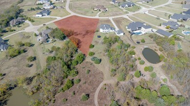 Aerial overview of property's location featuring nearby suburban area and a large body of water