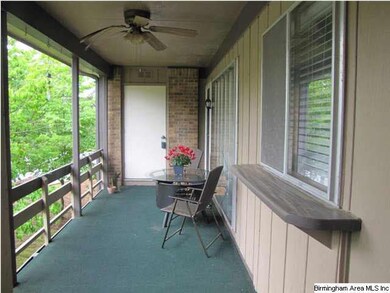 This shady balcony is long and wide with plenty of