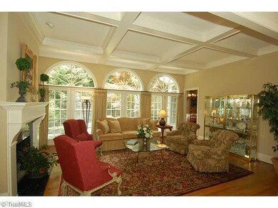 Den/Family/Great Room. Another view of Den shows a doorway to Breakfast Room and Kitchen.