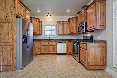 kitchen featuring granite countertops and all new stainless steel appliances