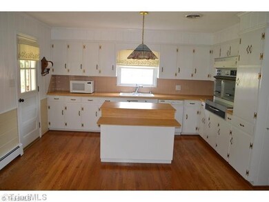 Kitchen. Huge kitchen with kitchen island that is movable but remains.