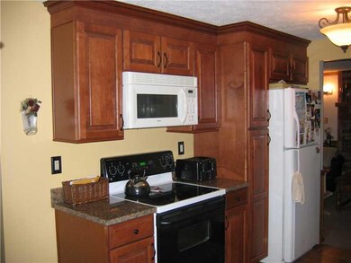 Kitchen. The kitcehn boasts extra cabinets for sto