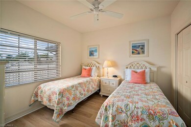 Bedroom featuring ceiling fan, a closet, and wood-