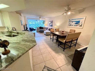 Dining area with light tile patterned floors and a