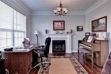 Living room/study or office with gas fireplace