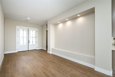 Spare room featuring light hardwood flooring