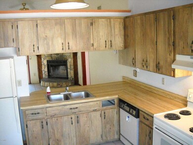 Kitchen view with white appliances