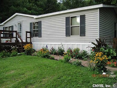 Exterior Front. Beautiful gardens blooming soon.