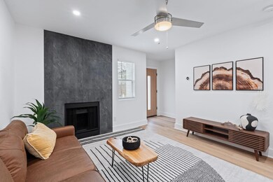 Living room featuring wood finished floors, baseb
