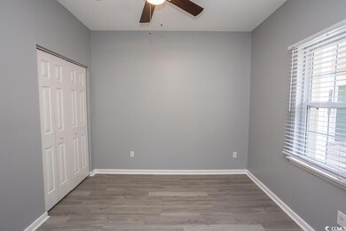 Unfurnished bedroom featuring ceiling fan, light h