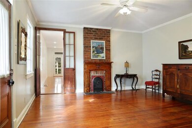 Cozy living room with antique French doors, brick