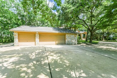 Extended garage with storage space, workshop and half bath