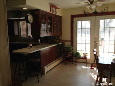 Kitchen Dining. French doors lead out to the deck 