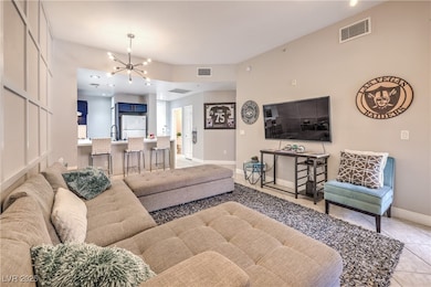 Living area featuring light tile patterned floorin